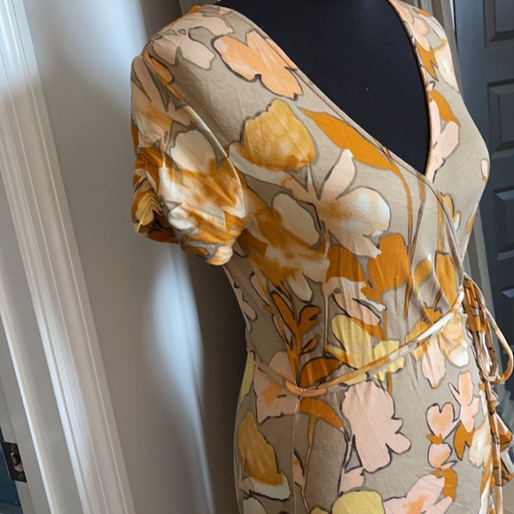Fun Flirty and Flattering Faux Wrap Floral dress! Gently used. Only worn twice. - Picture 5 of 6